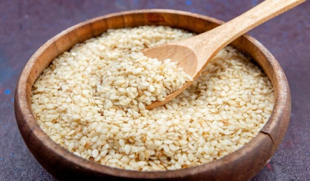 A landscape image of a bowl filled with magaj seeds and a plate of magaj burfi, highlighting traditional Indian flavors.